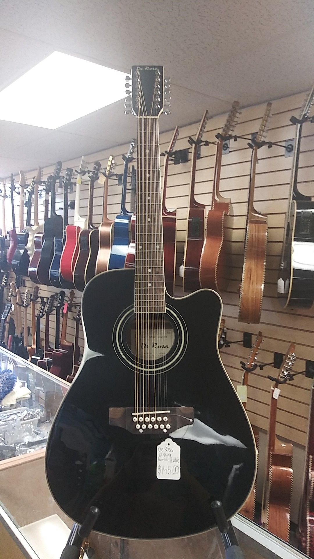 DE ROSA 12 STRING ACOUSTIC/ELECTRIC GUITAR. (BLACK). #.VCH009. NEW. ON SALE FOR $145.00. (HAVE IT IN LEFTY TOO).
