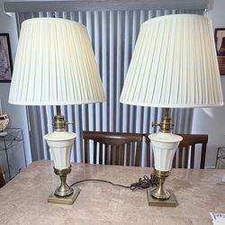 A pair of Beautiful Stiffel Brass table lamps with Lenox Ivory colored Ceramic and you can place them with glass or the pleated shades.