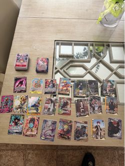 A bunch of One Piece DragonBall and Naruto cards