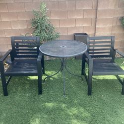 Two Chairs One Table Outside Doors