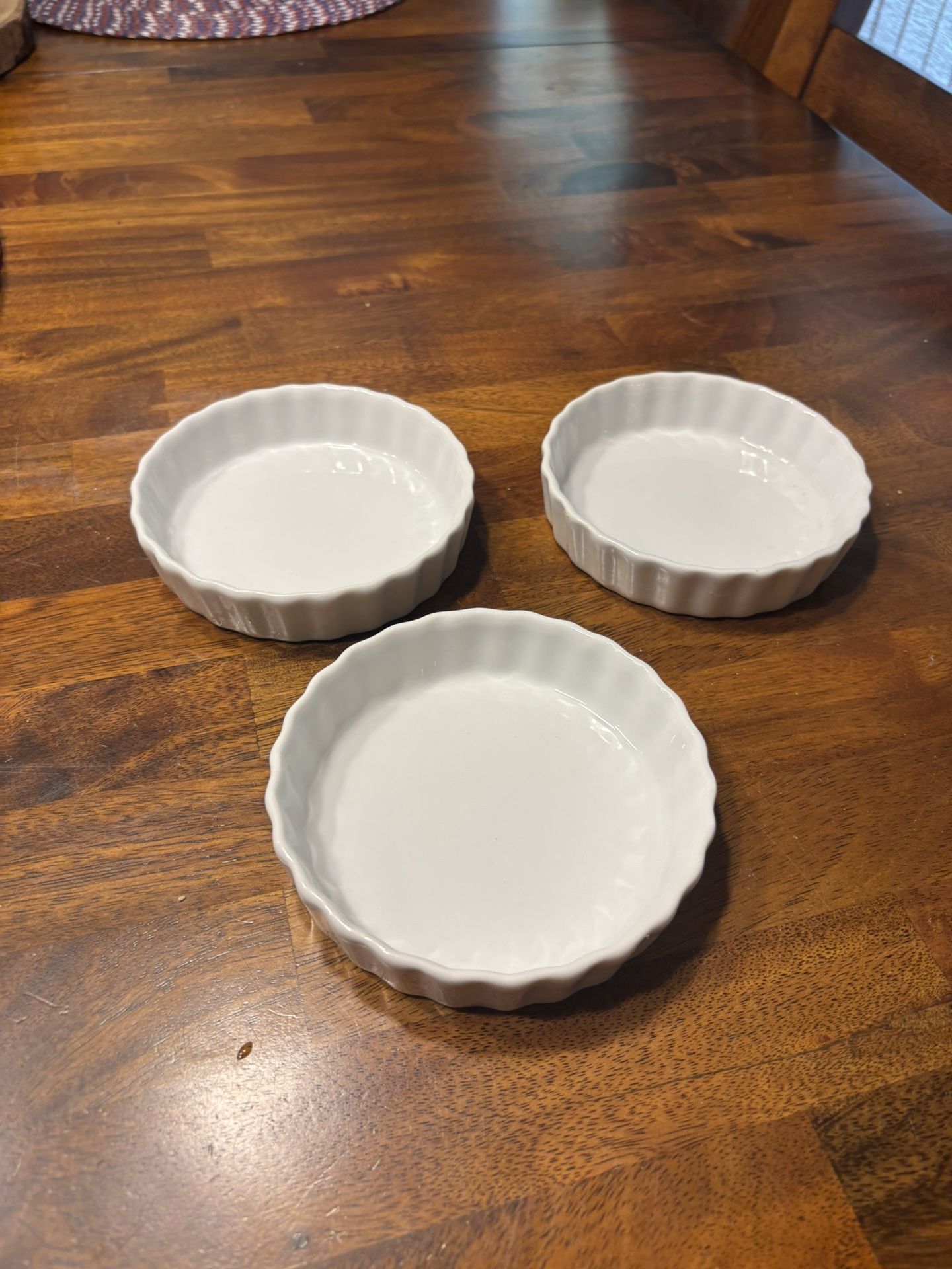 Set of three white ramekins