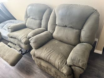 Two green recliner chairs and a two seat couch.