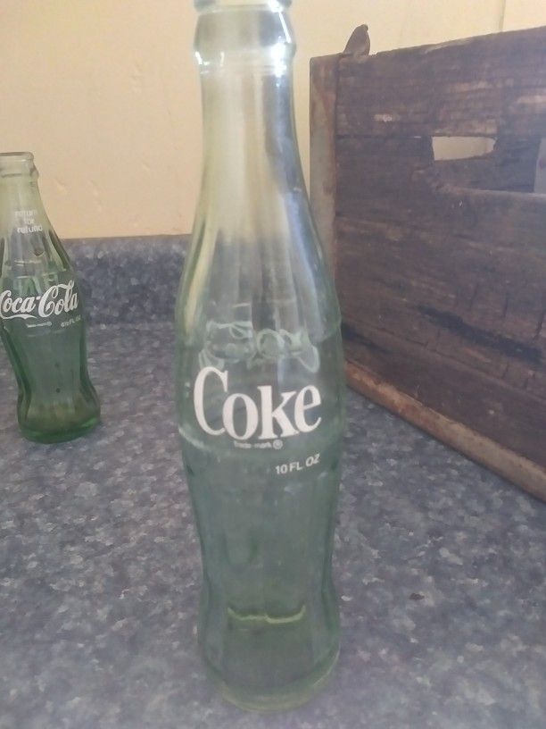 Assorted Glass Bottles And An Old Milk Crate