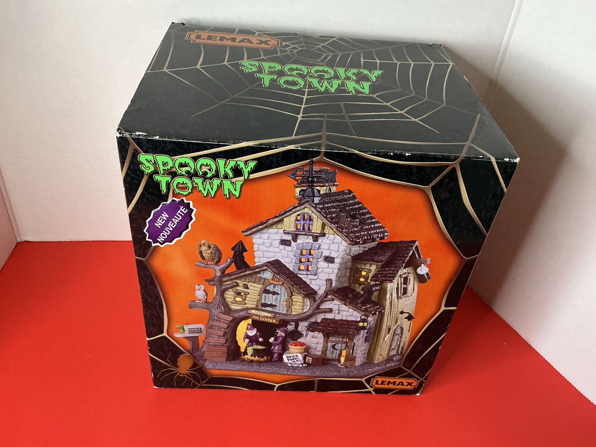 LEMAX Spooky Town Haunted House With Green And Orange Accents