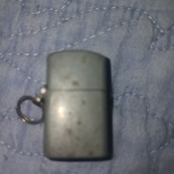 Vintage little tiny lighter I don't know what it's made out of I never cleaned it I've had it for years