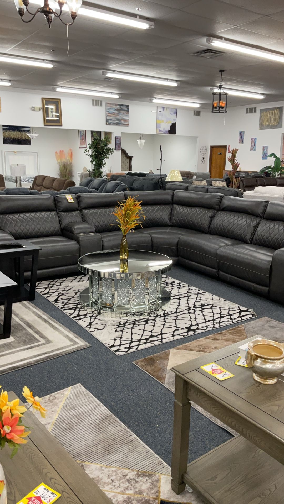 Electrice Leather Reclining Sectional With Cupholders And USB Plug In $2599