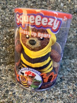 Squeezy dress up bear