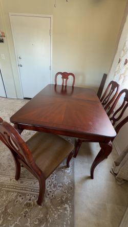 a Dinner Table and 4th chairs