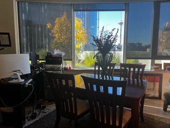 Well-made table for six includes four chairs