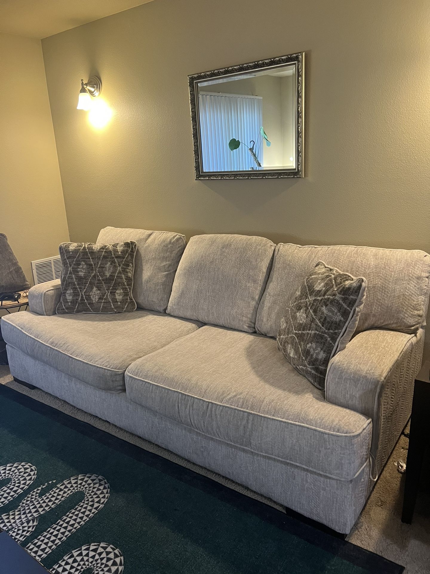 Beige Couch With 5 Pillows