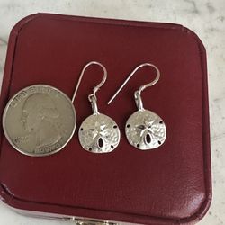 925 Sterling silver Sand dollar dangle earrings , marked 925 on the back and the hooks , diamond cut .