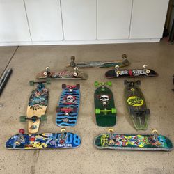 9 Skateboards some Cruz boards and one longboard 