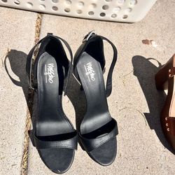 Two different pairs of black heels, both an excellent condition