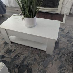 Nice coffee table with compartment to store papers 
