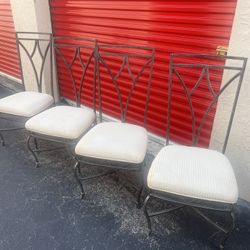 vintage wrought iron sculptural dining chairs.