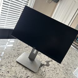 This is a Dell UltraSharp U2415 24-inch monitor. 