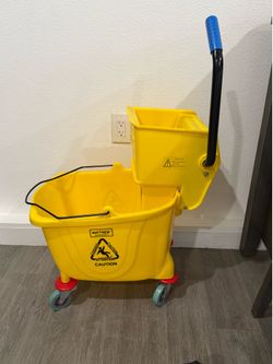 Yellow mop bucket