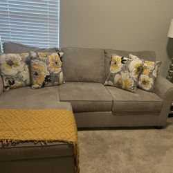 Grey Couch With Four Pillows