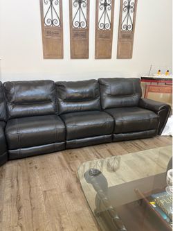 Leather (not faux) sectional w/recliner on each end