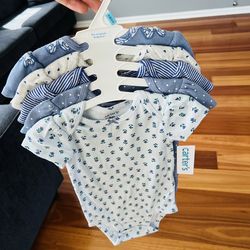 set of Carter's baby girls' short-sleeve bodysuits featuring a butterfly print design.
