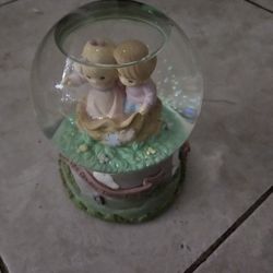 Precious moments  in snow globe