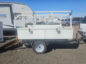 Utility trailer with tool boxes