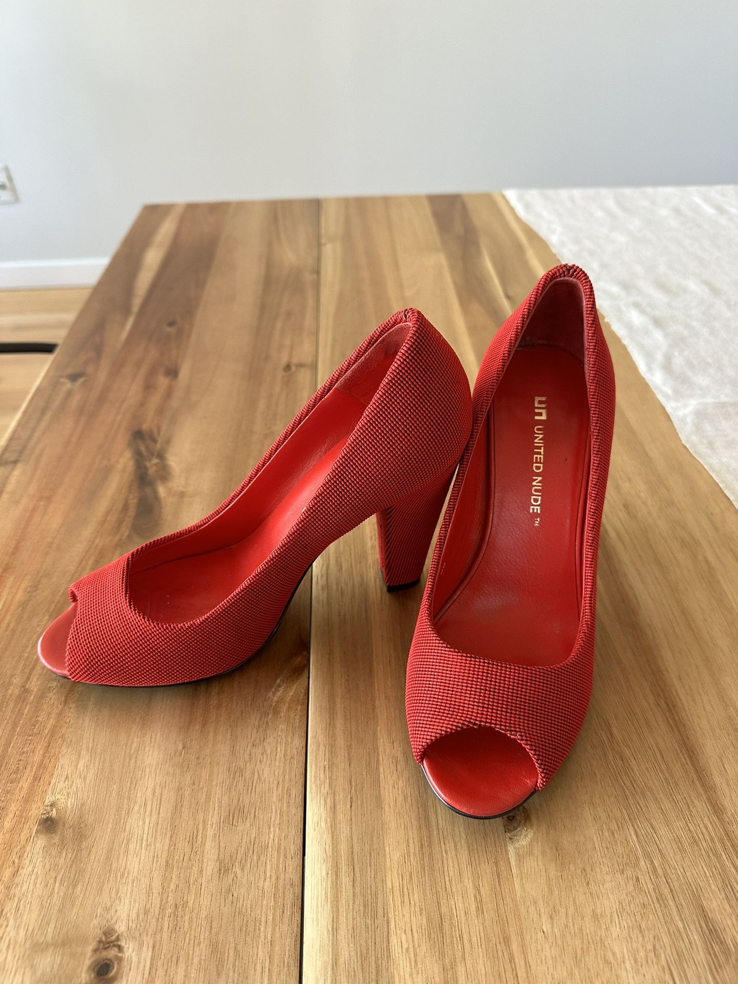 United Nude peep-toe red pumps