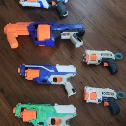 4 Nerf Guns And 2 X-shot
