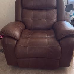 Brown two reclining chairs and reclining loveseat with the center console