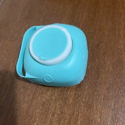 Spa brush that you fill with soap or shampoo in teal 