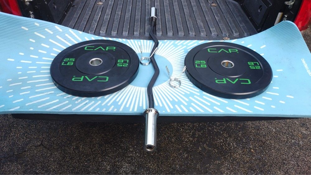 PAIR OF 25 LB. OLYMPIC BUMPER PLATES & NEW OLYMPIC EASY CURL BAR