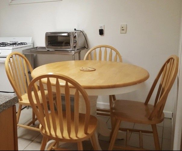 Solid Wooden Dining Room Table and Four Chairs