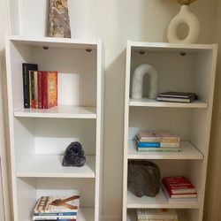 2 White Book Shelves With Out The Items On Shelves 
