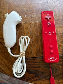 Nintendo Wii Remote Plus (Red) bundled with a matching white Nintendo Wii Nunchuck.