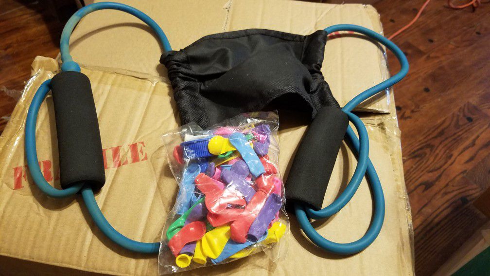 3 person water balloon sling shot with balloons and nozzle