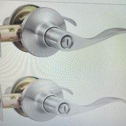 A new 2 pack of privacy door levers with interior keyless locks - still in box. 