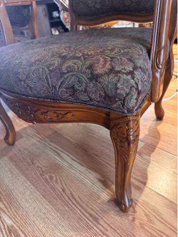 Two wood accent chairs with table