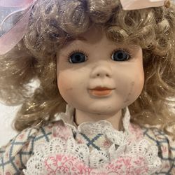 This image shows a vintage-style collectible porcelain doll, likely from the late 20th century.