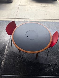 Round Dining Table with Two Red Chairs