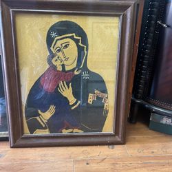 Framed representation of the Black Madonna of Częstochowa, a revered icon in Christianity