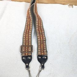  1970's Camera Strap adjustable length 2" wide with Film Holder flex attachments on underside SEEPics
used not abused. Does show very minor signs of u