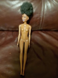 African-American fashion Barbie doll with April hairstyle and blue lipstick