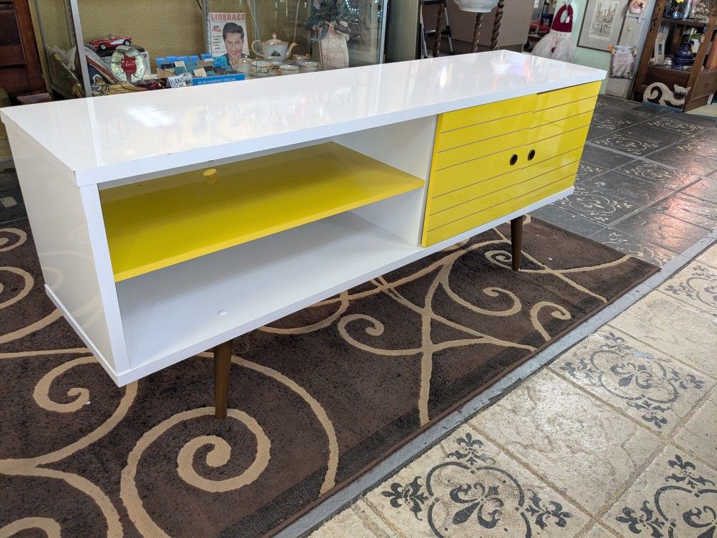 Mid-Century modern credenza/ TV stand banana, yellow and white measures 63 in Long 25 and 1/2 in high 15 in deep