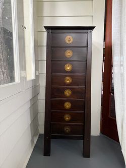 Unique dark wood tall cabinet / dresser