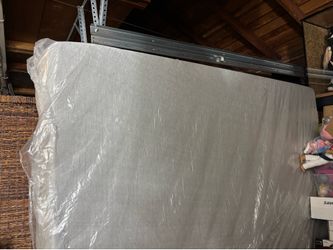 King size thick foam mattress covered with plastic wrap