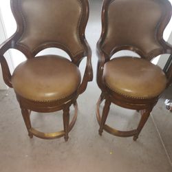 
A pair of Artistica Winston swivel barstools