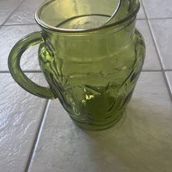 Vintage-style green glass pitcher with handle approx H8.5” W7” e handle included.
