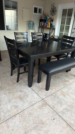 Black dining table and 4 chairs one bench