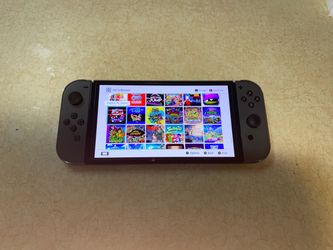 NINTENDO SWITCH OLED MOD with 125 SWITCH GAMES and Over 7500 CLASSIC GAMES