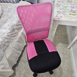 Barely used adjustable chair with wheels.